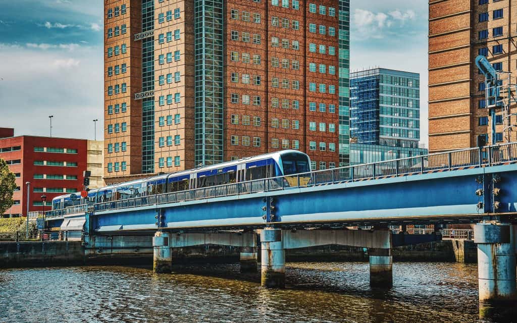 A commuter train traveling over the River Lagan at Belfast Waterfront (May, 2019).
