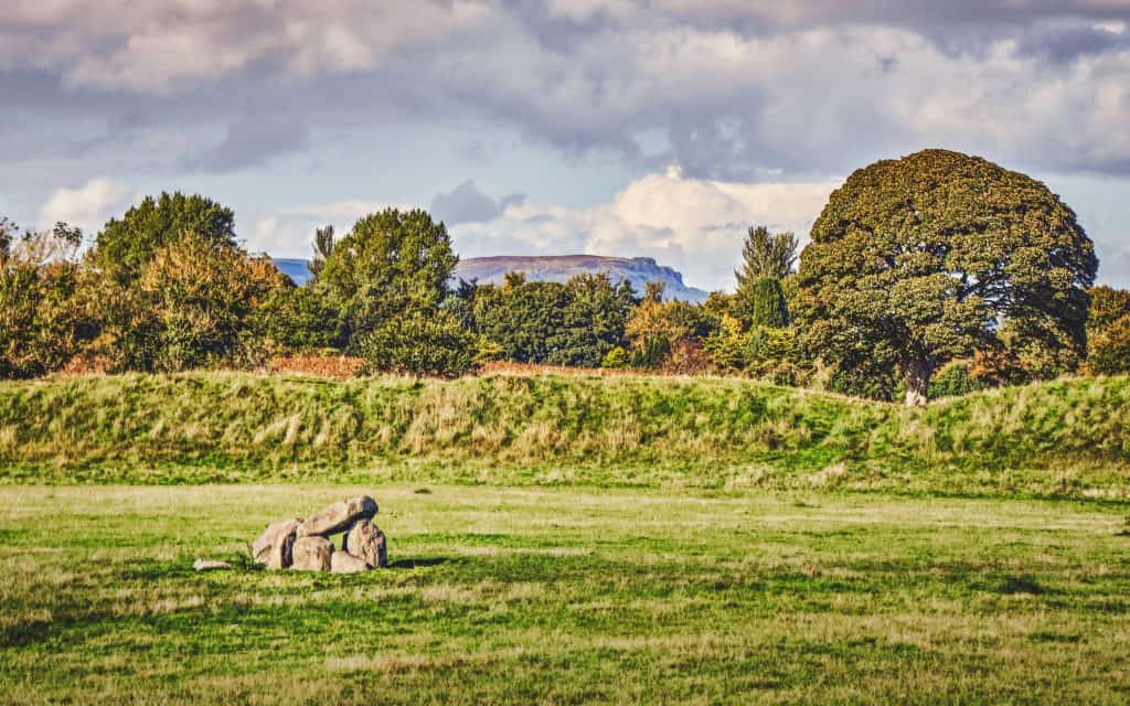 The Neolithic megalith dolmen--an ancient portal tomb--and massive earthworks at Giant's Ring with Cave Hill in the background (Sep., 2021). You can read more about the Giant's Ring here:
https://www.belfastentries.com/places/places-to-see/the-giants-ring/